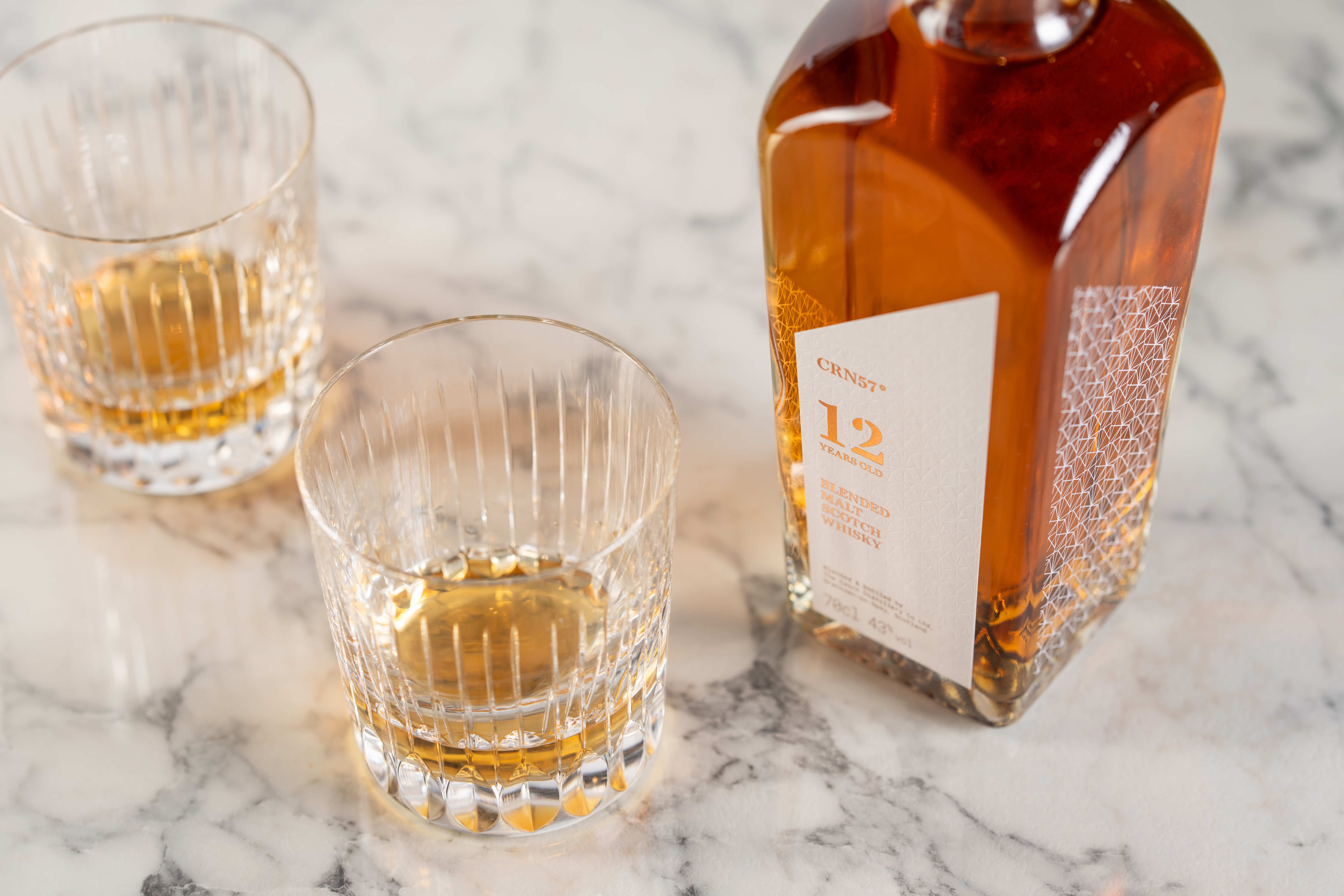 An image of CRN57 12 year old blended malt scotch whisky with two glasses