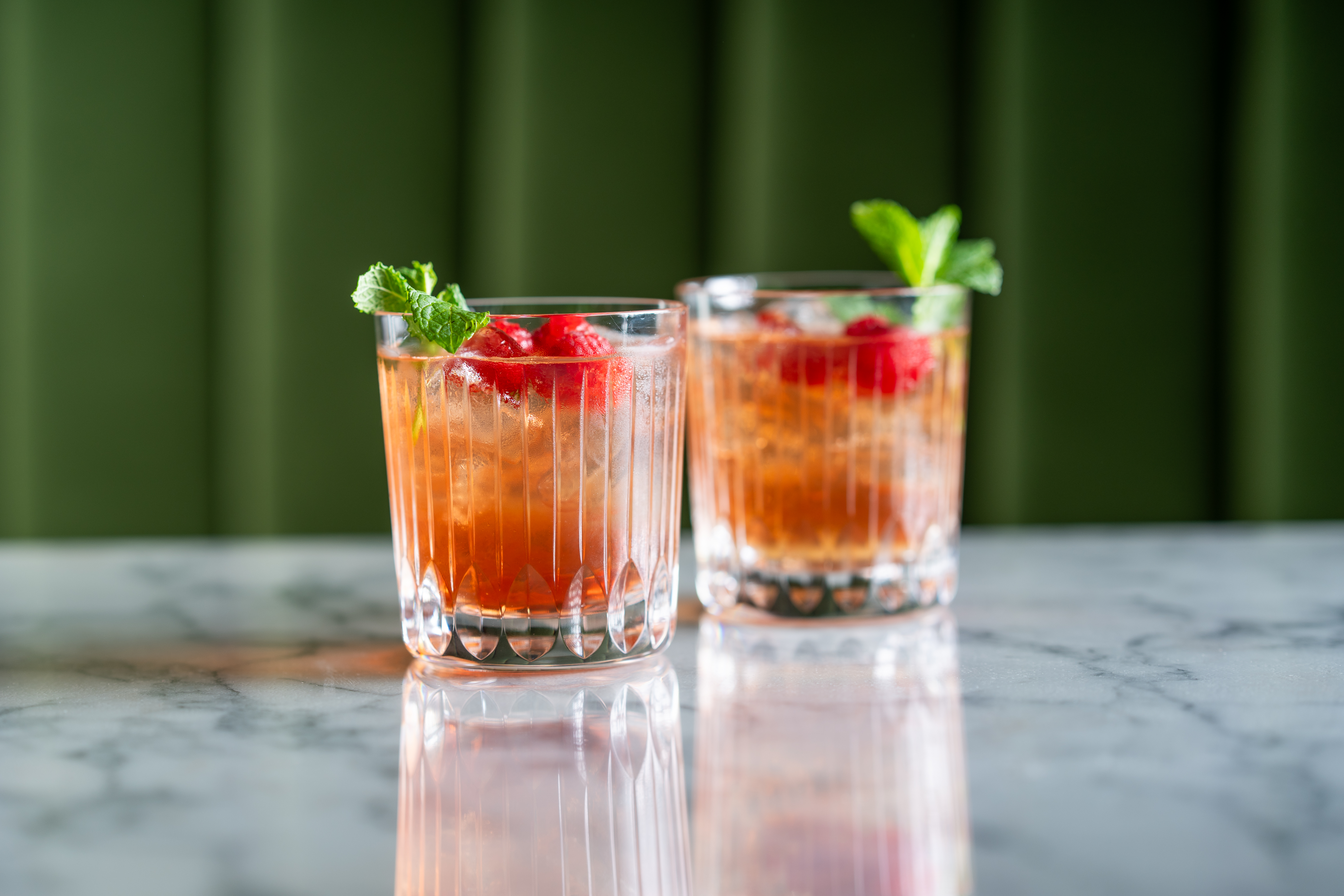 two cocktail tumblers containing CRN57 18 year old cocktail