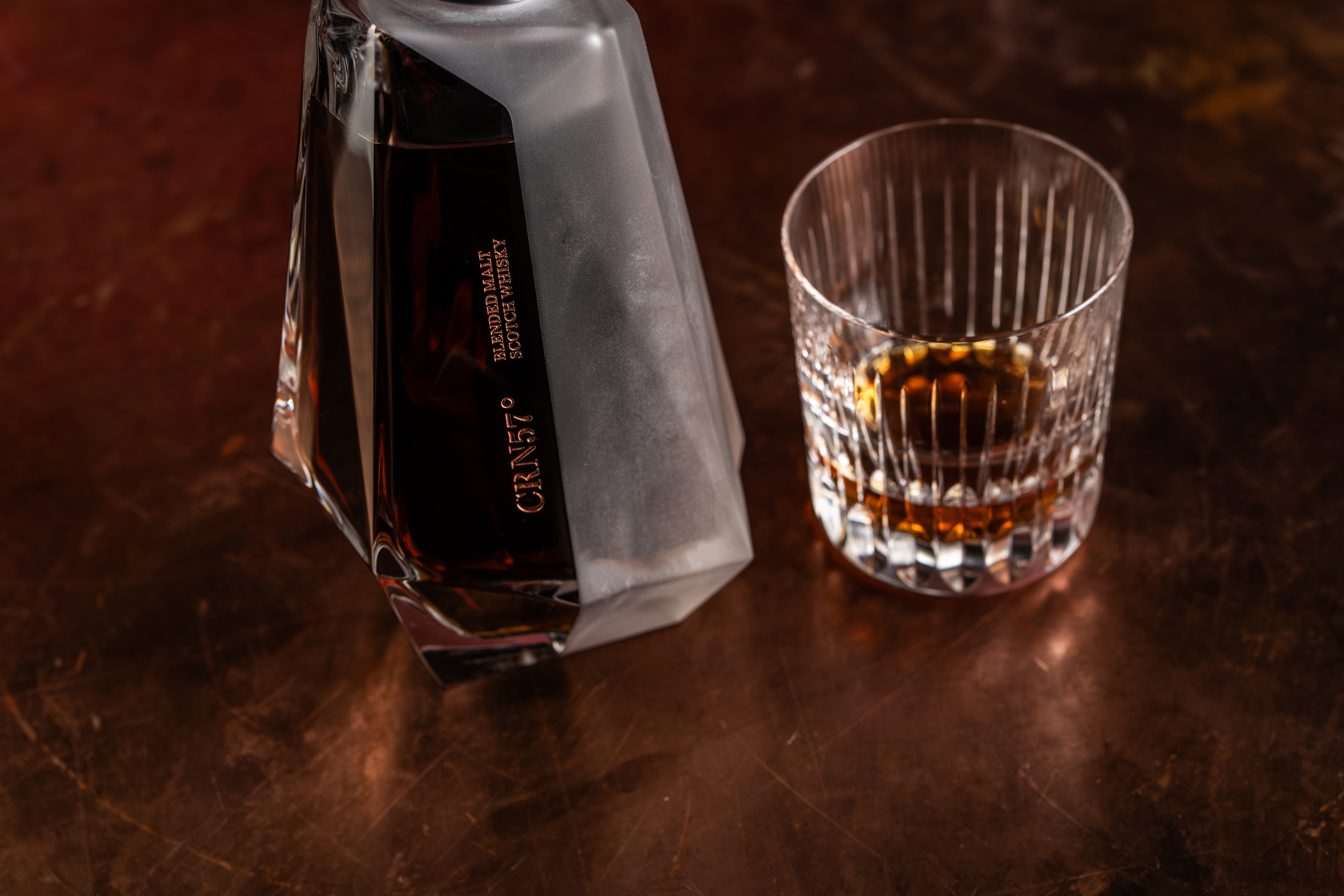 A whisky decanter containing CRN57 57 year old blended malt Scotch whisky and one glass